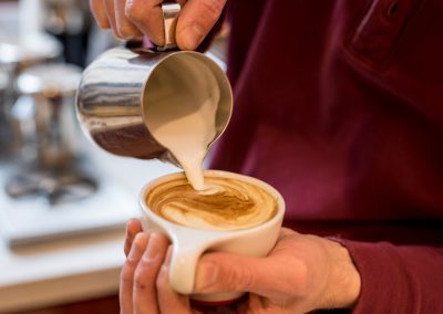 Man drinking coffee near affordable Wilmington apartment